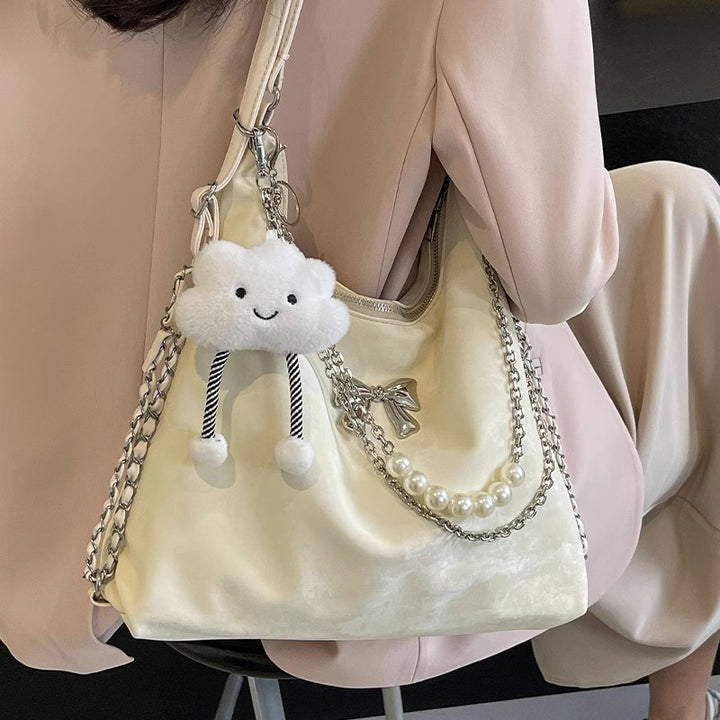 Fashionable handbag with unique pendant and chain accents Kalsten