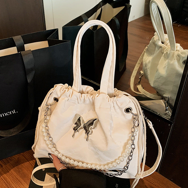 Elegant Pearl-Accented Mini Drawstring Handbag