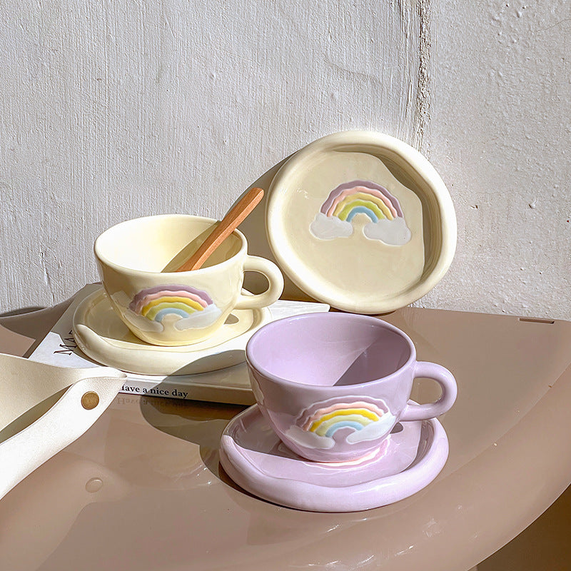 Stoneware breakfast mug with saucer and embossed rainbow design