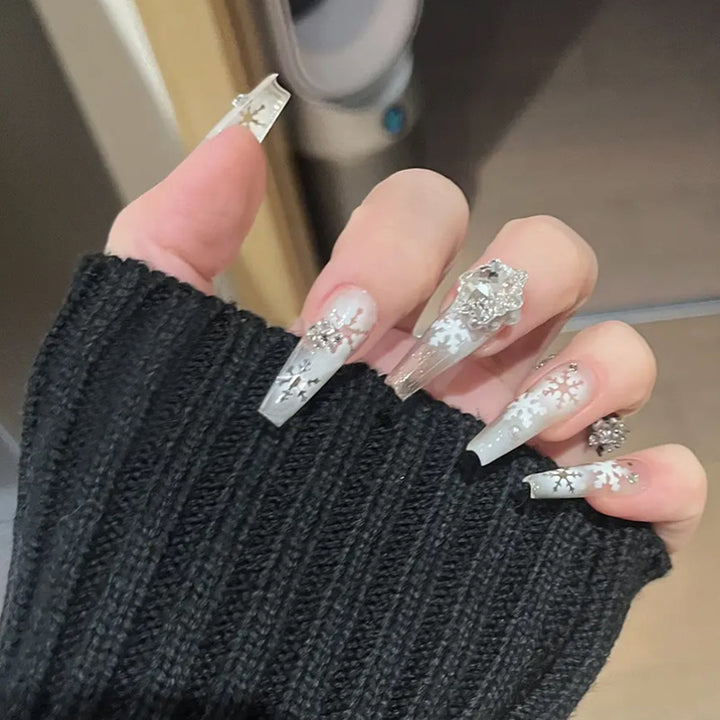 Artificial nail set with frosty snowflake design and sparkling 3D applications Kalsten