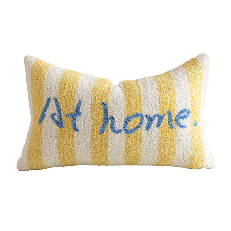 Striped bouclé decorative pillow with embroidered lettering and cuddly filling