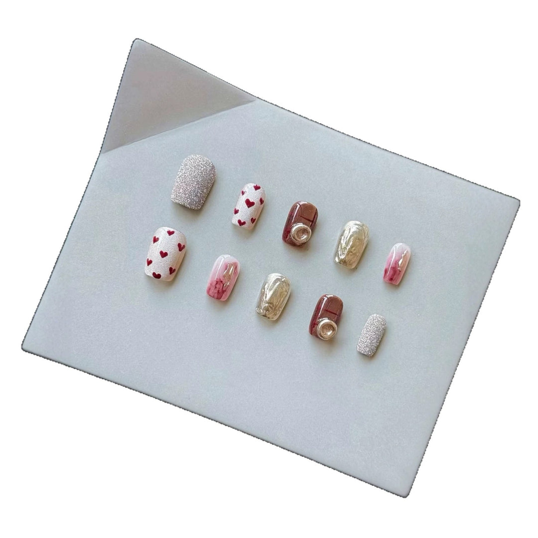 Artistic Press-On Nail Set with Heart and Glitter Accents