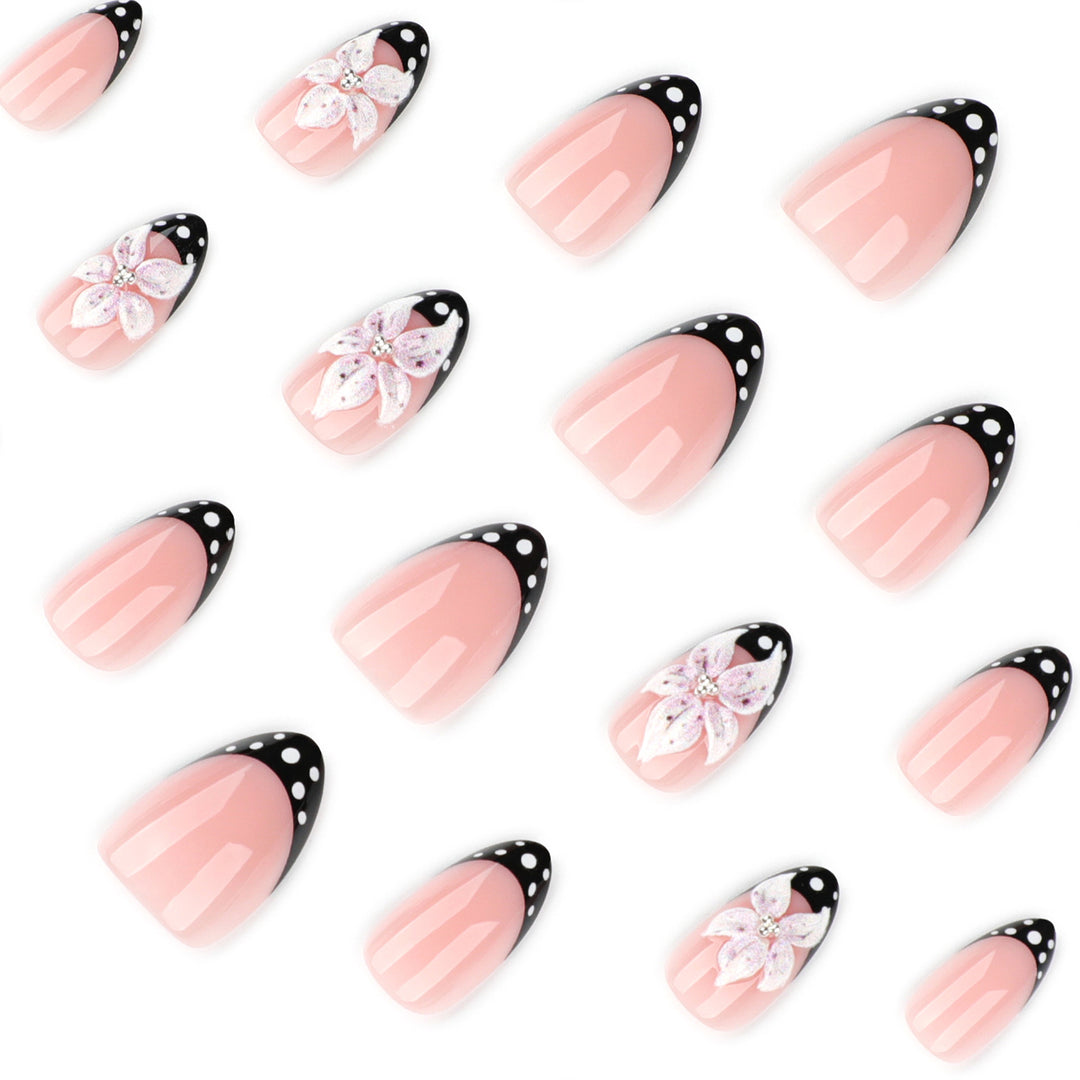 Artistic nail art with floral designs and elegant accents Kalsten