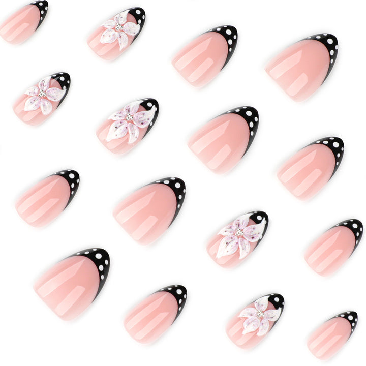 Artistic nail art with floral designs and elegant accents Kalsten