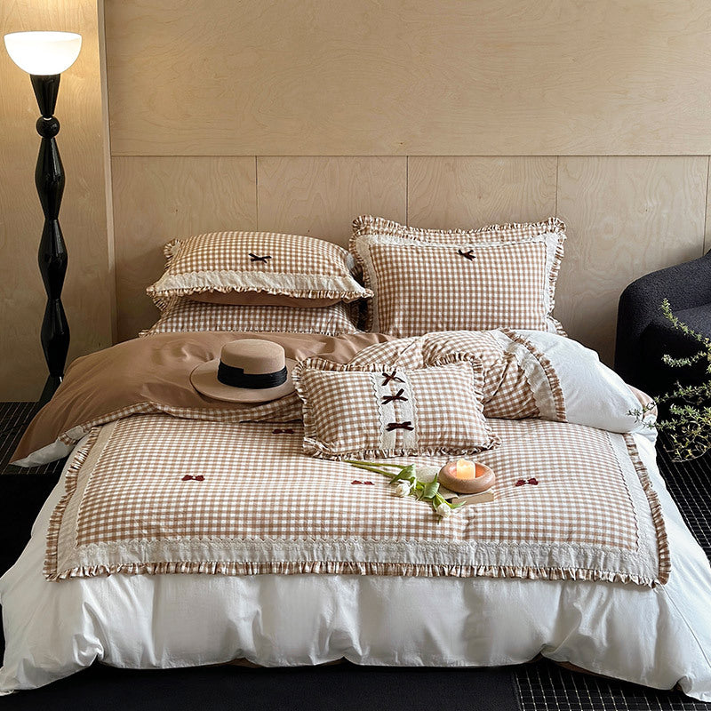Bedding set in country house style with Vichy check, ruffle and embroidery appliqués