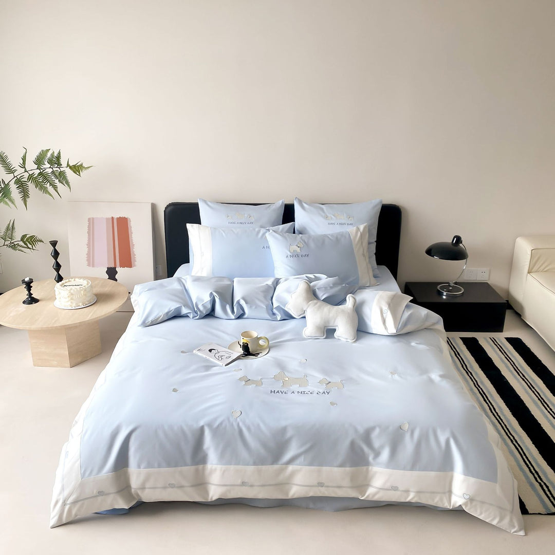 Cotton satin bedding set with embroidered dog motifs and reversible function