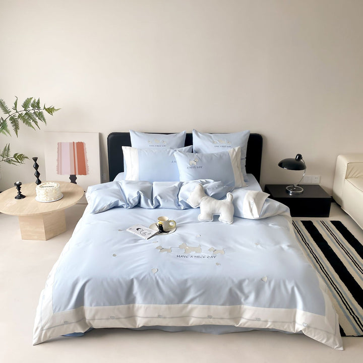 Cotton satin bedding set with embroidered dog motifs and reversible function