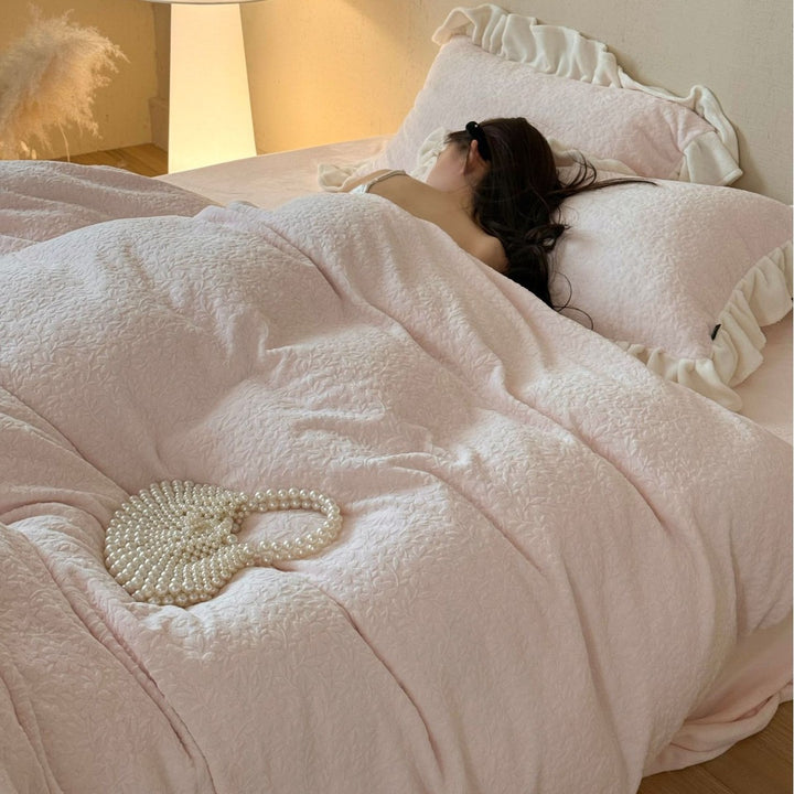 Bedding set with ruffle border and textured cotton blend