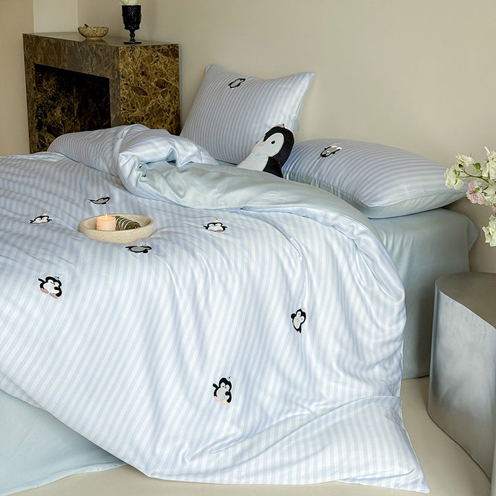 Satin bedding set with silky glossy striped design and subtle panda illustration