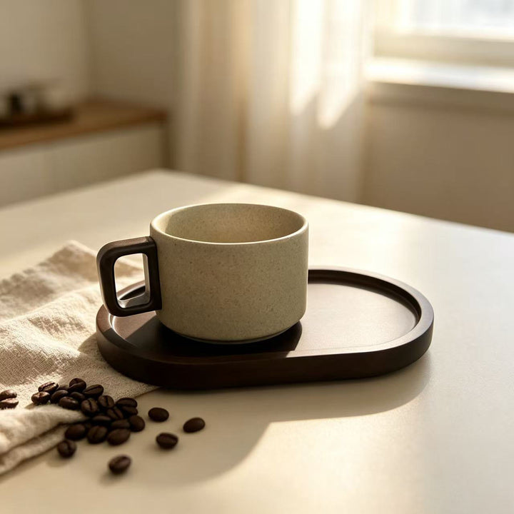 Ceramic mug with ergonomic wooden handle and matching coaster