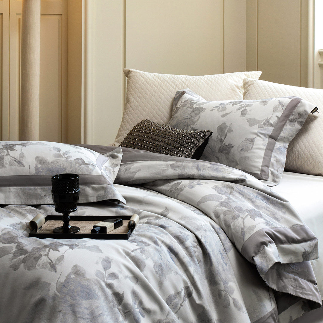 Cotton satin duvet cover set with delicate watercolor floral print, piped edge and matching pillowcases