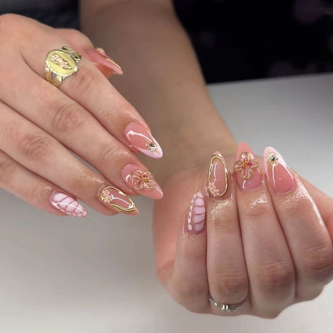 Artful nail design with glitter and floral accents Kalsten