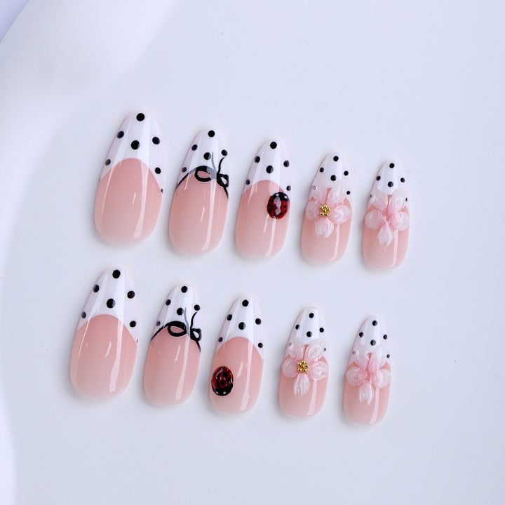 Artificial nail art with floral and playful accents Kalsten