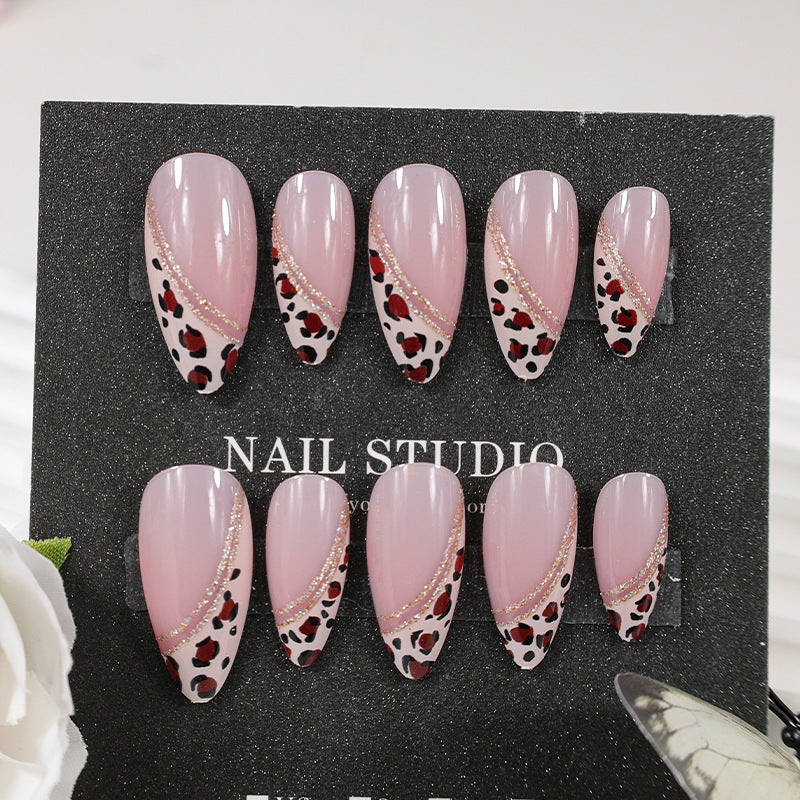 Acrylic nail set with glamorous animal print and elegant accents Kalsten