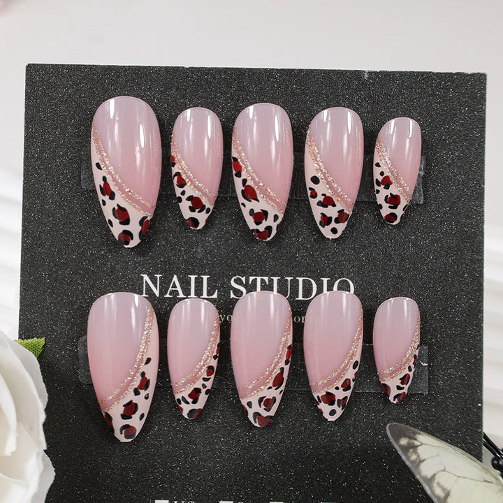 Acrylic nail set with glamorous animal print and elegant accents Kalsten