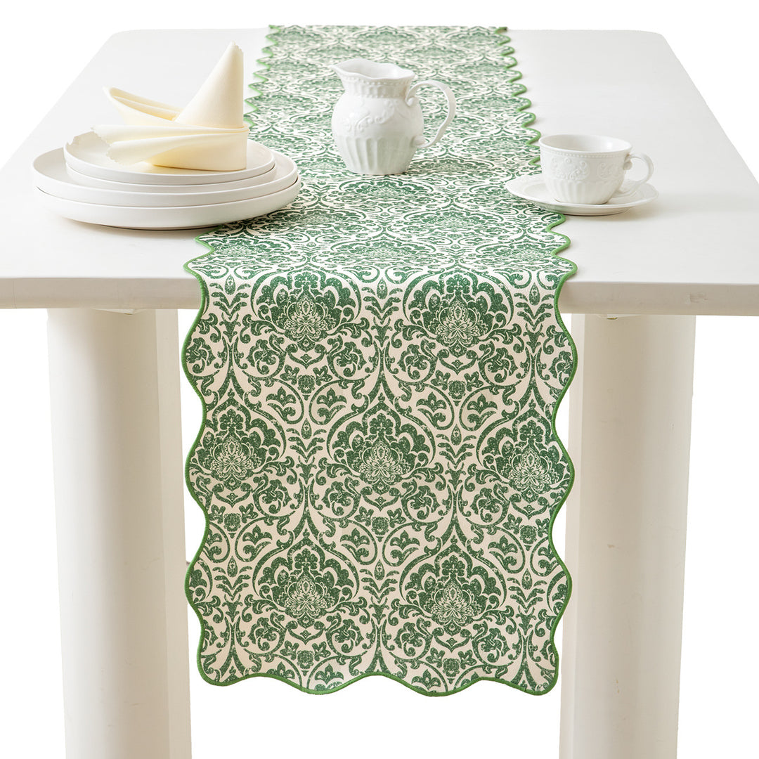 Damask-style table runner with curved wave edge and fine ornamental print Kalsten