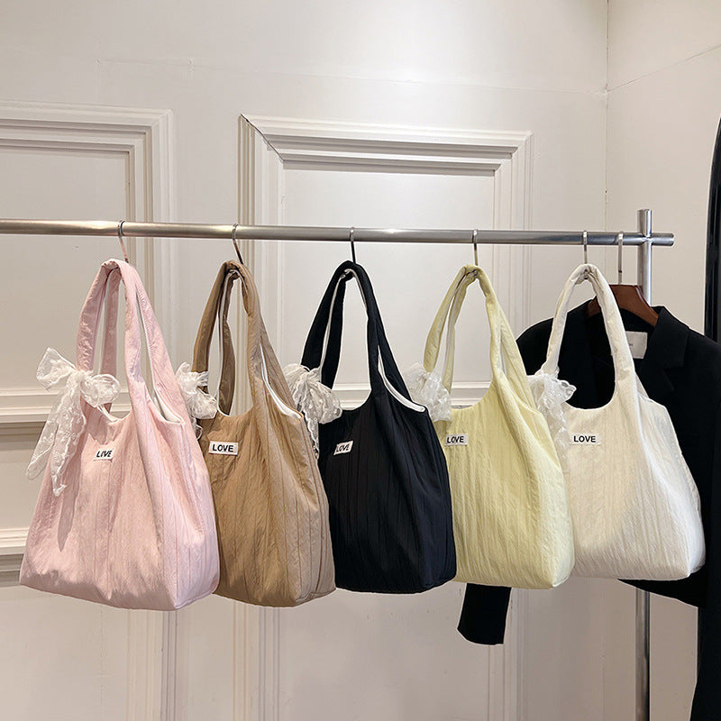 Leisure bag with structured design and playful scarf Kalsten