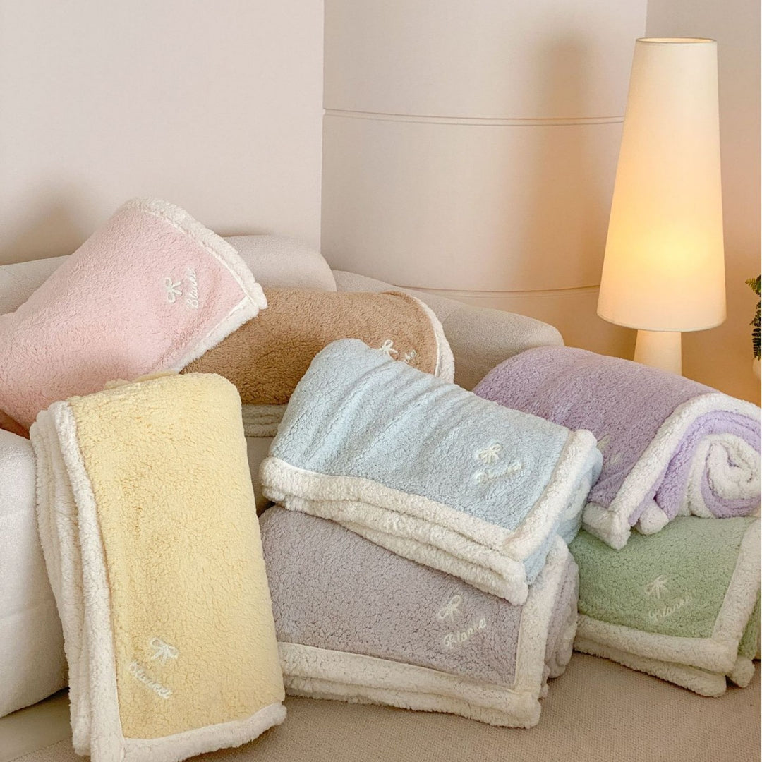 Cozy Sherpa blanket with reversible fleece lining