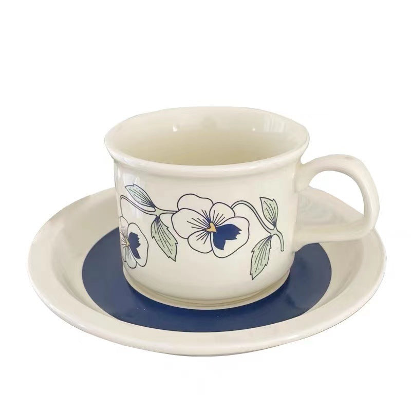 Fine porcelain tea cup with saucer and delicate floral motif