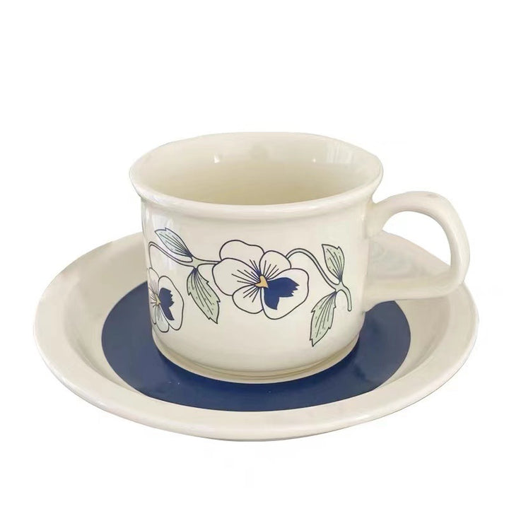 Fine porcelain tea cup with saucer and delicate floral motif