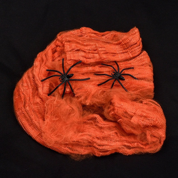 Decorative Halloween spider web with artificial spiders