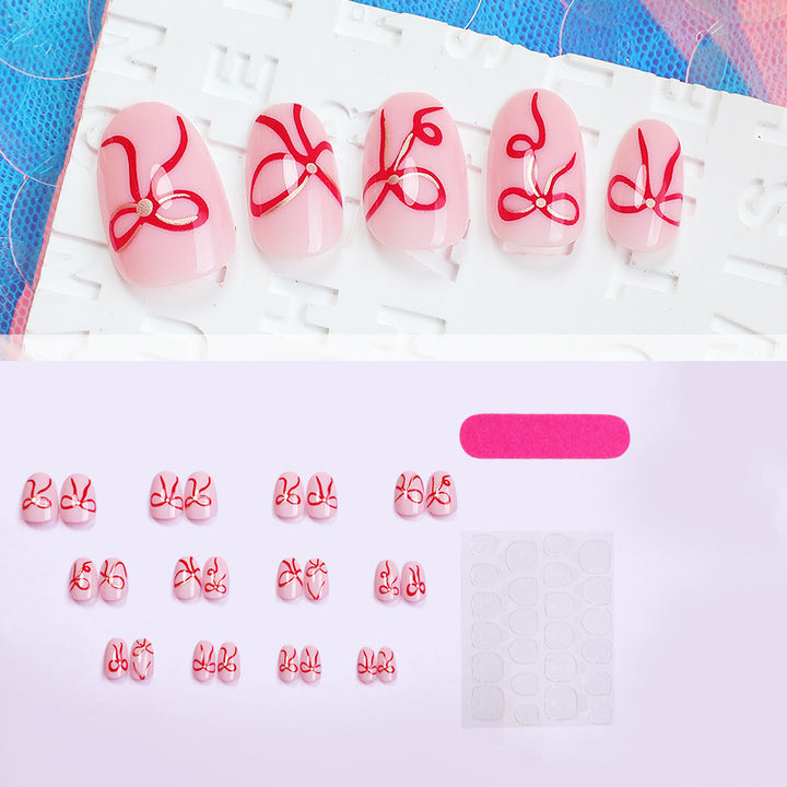 Artificial nail design with bow motifs Kalsten