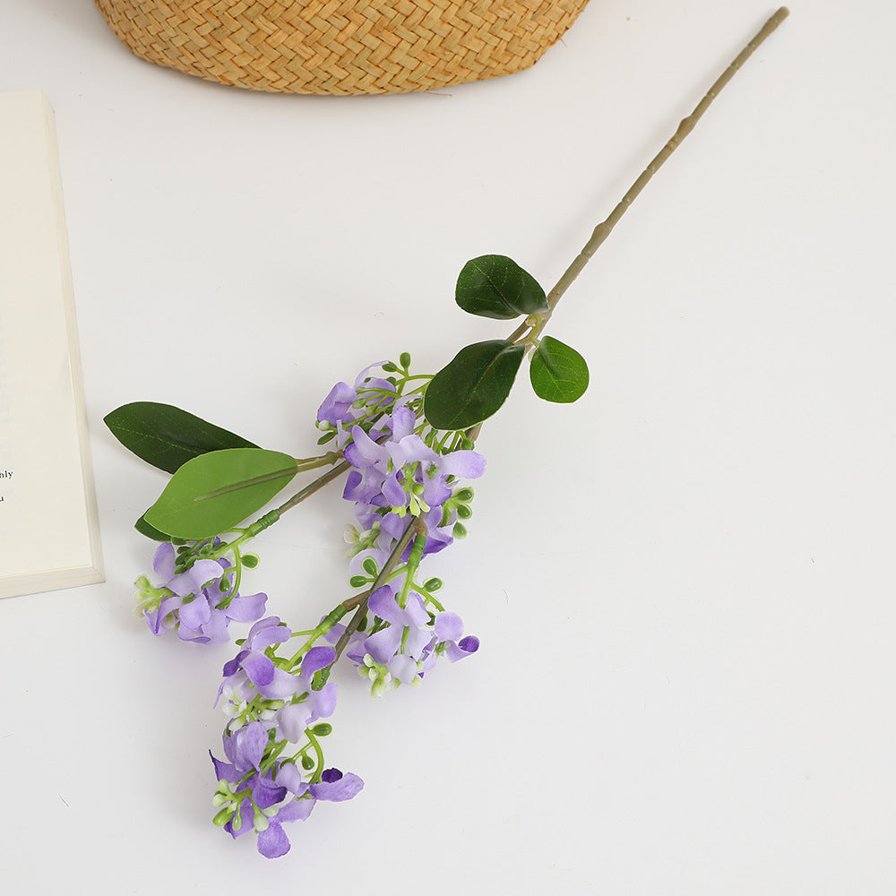 Artificial flower branch with bright flowers