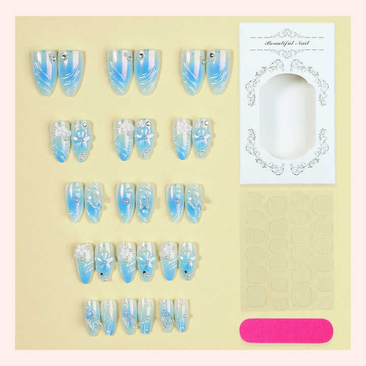 Artificial nail creation with floral designs and glitter accents Kalsten
