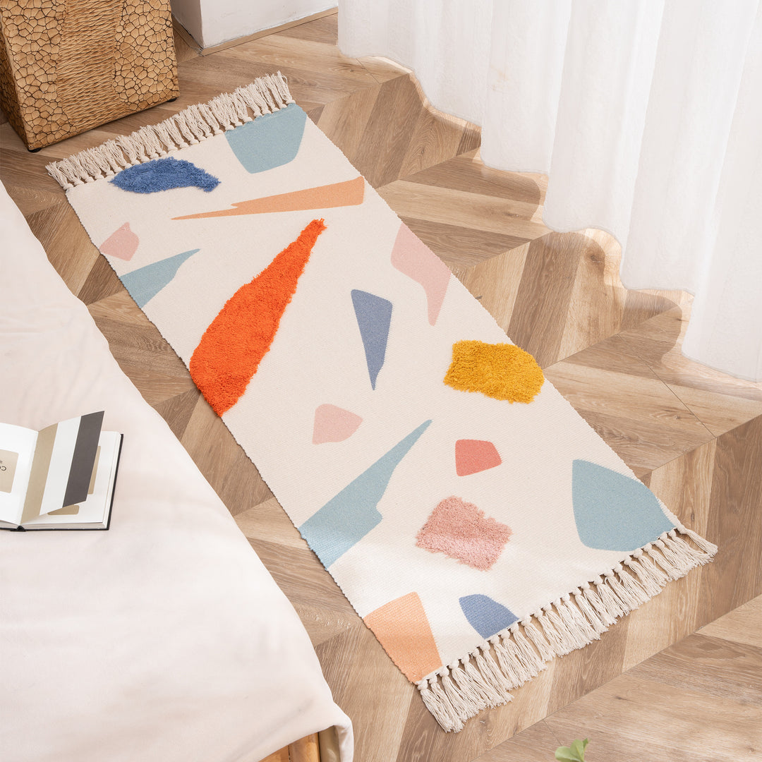 Woven runner with hand-tufted 3D applications and fringes