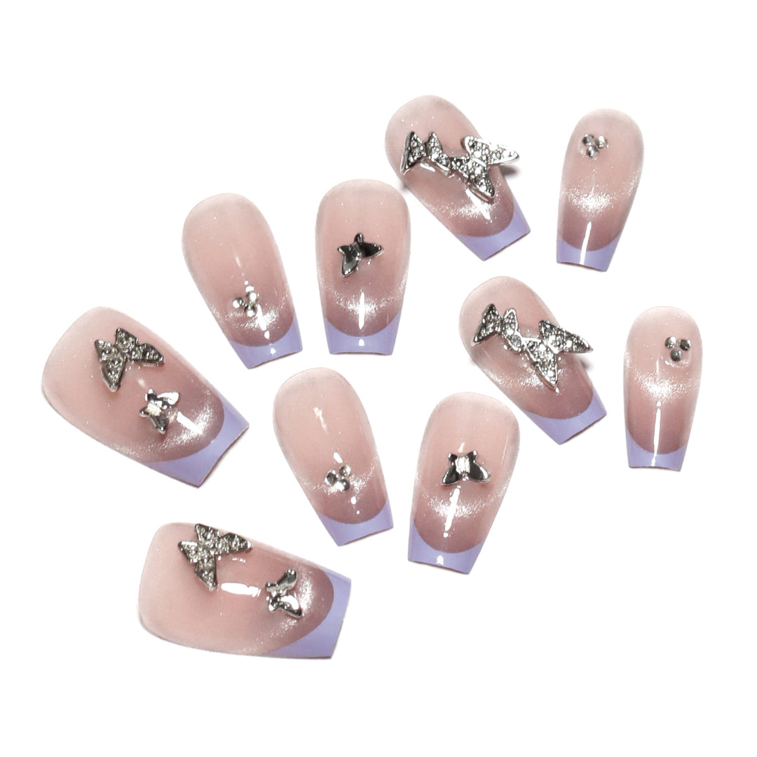 Artificial nail extensions with glitter design and elegant accents Kalsten