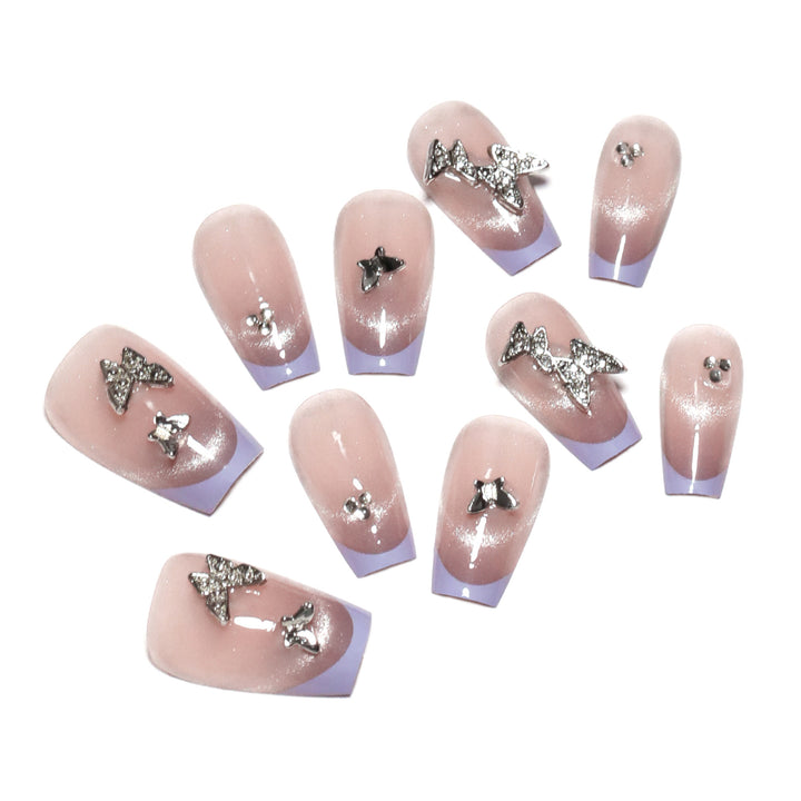 Artificial nail extensions with glitter design and elegant accents Kalsten