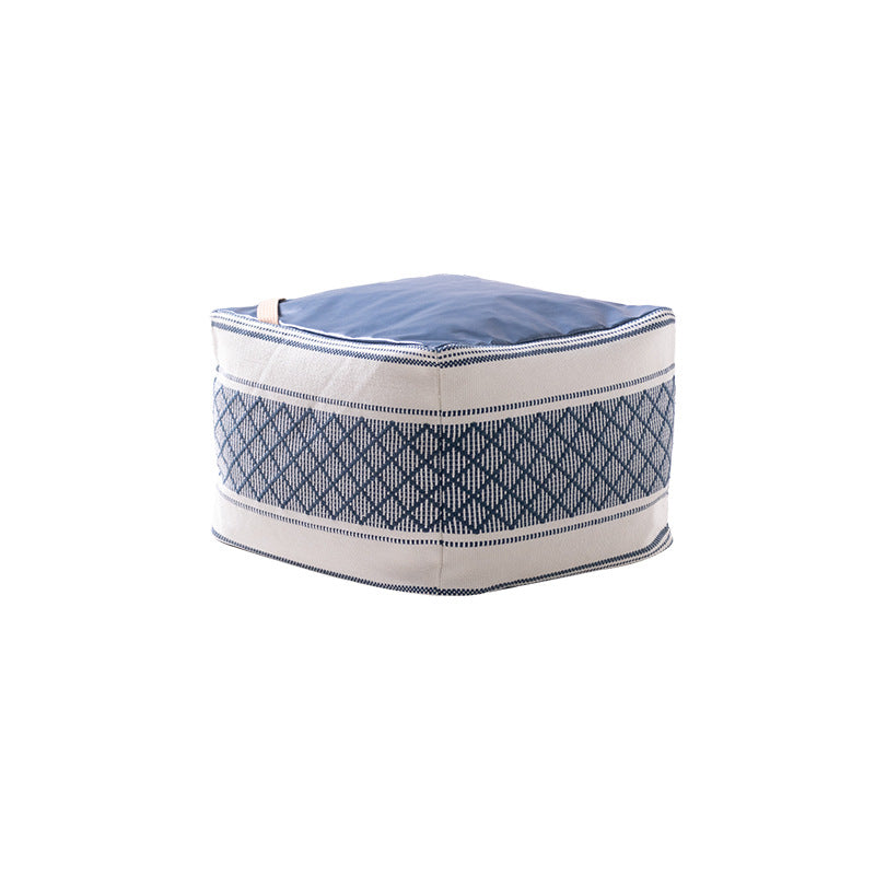 Woven seat pouf with quilted synthetic leather top and carry handle