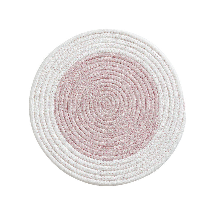 Round handwoven table placemat made of cotton yarn with structured spiral binding