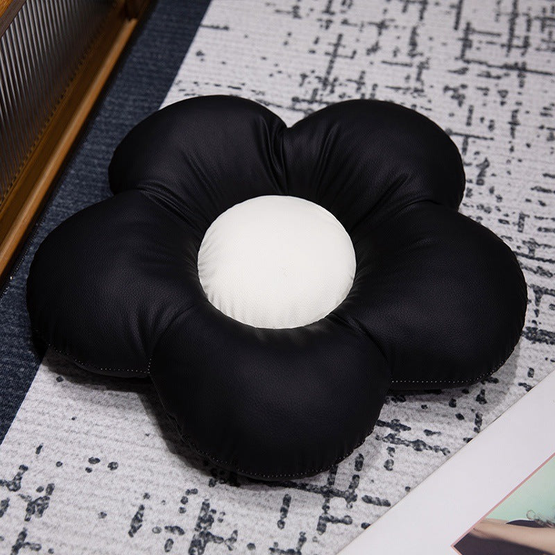 Padded seat cushion in flower shape with faux leather center piece and fluffy edge padding