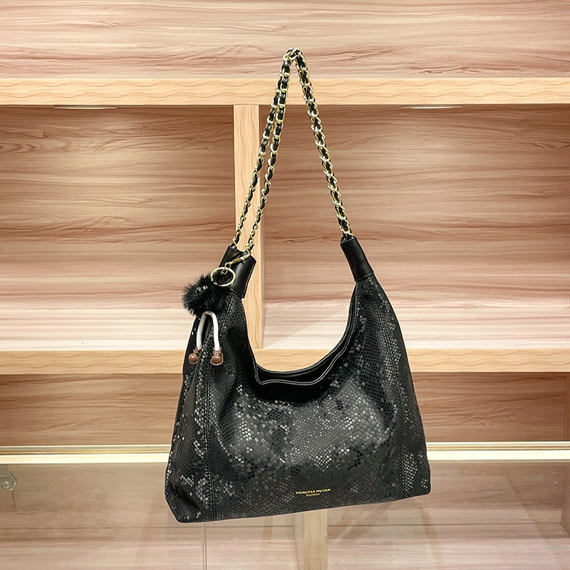 Chic Shoulder Bag with Decorative Charm