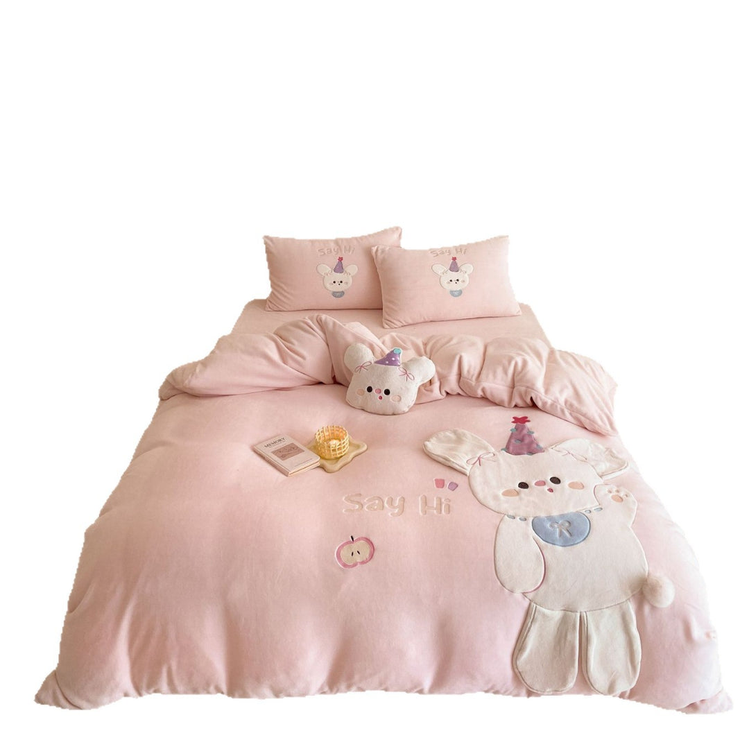 Children's bedding set with appliquéd cuddle bunny, quilted blanket and decorative pillows