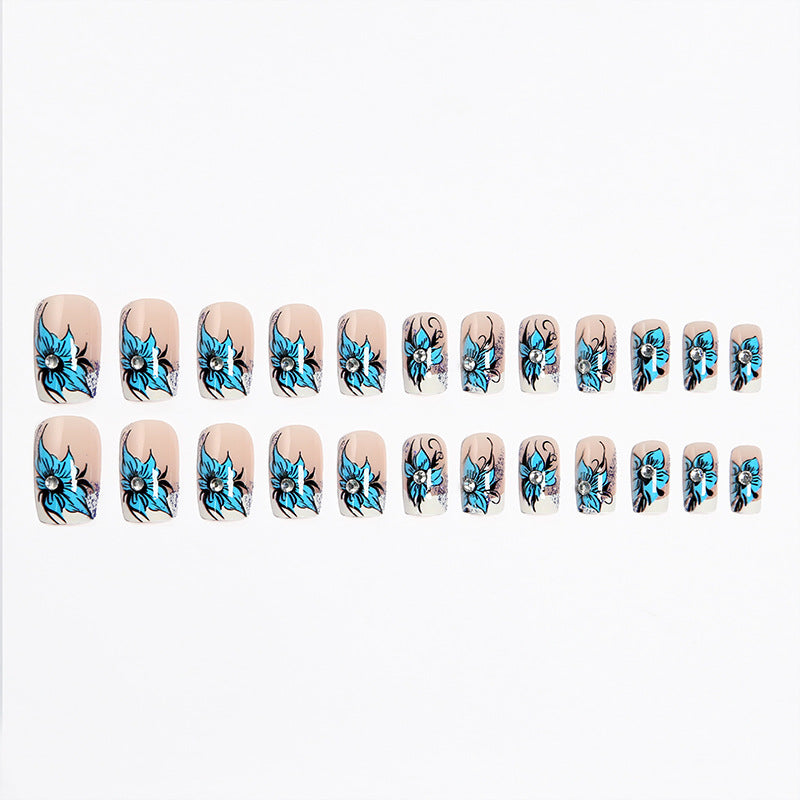 Artificial nail set with intricate floral designs and glitter elements Kalsten