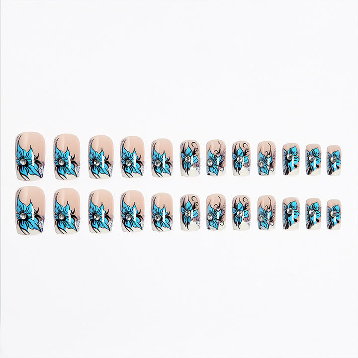Artificial nail set with intricate floral designs and glitter elements Kalsten