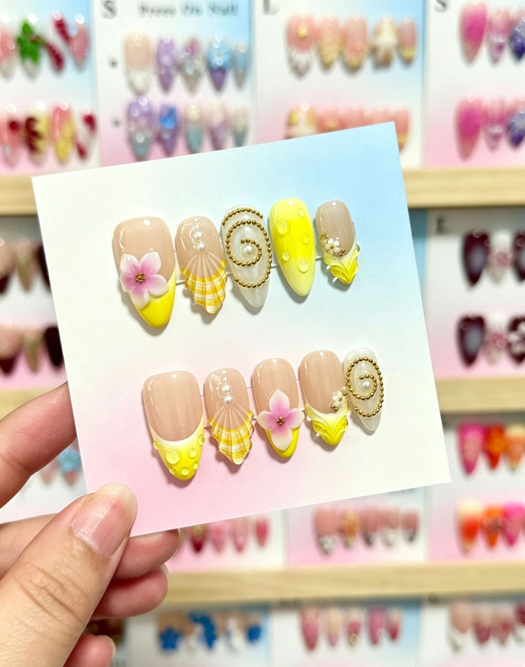 Artistic Press-On Nail Art Set with Floral and Shell Accents