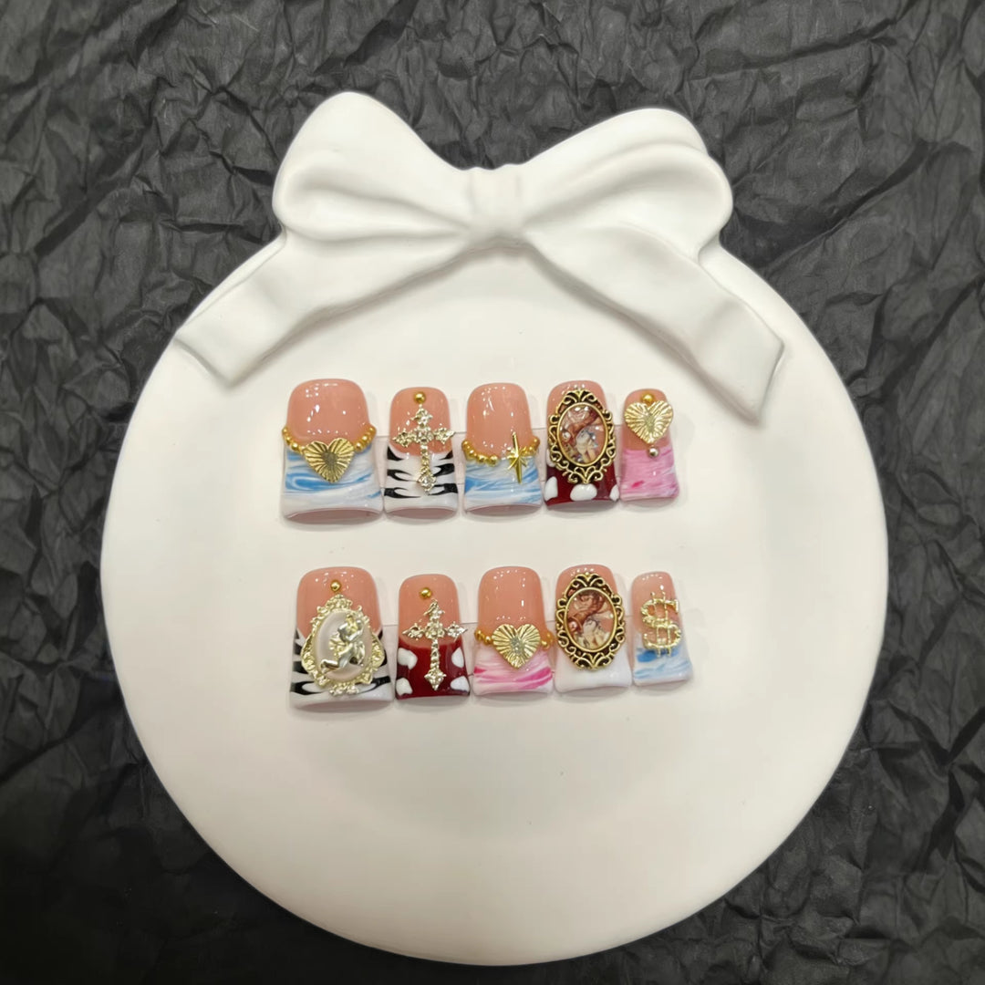 Artistic Press-On Nail Set with Gold Accents and Unique Designs