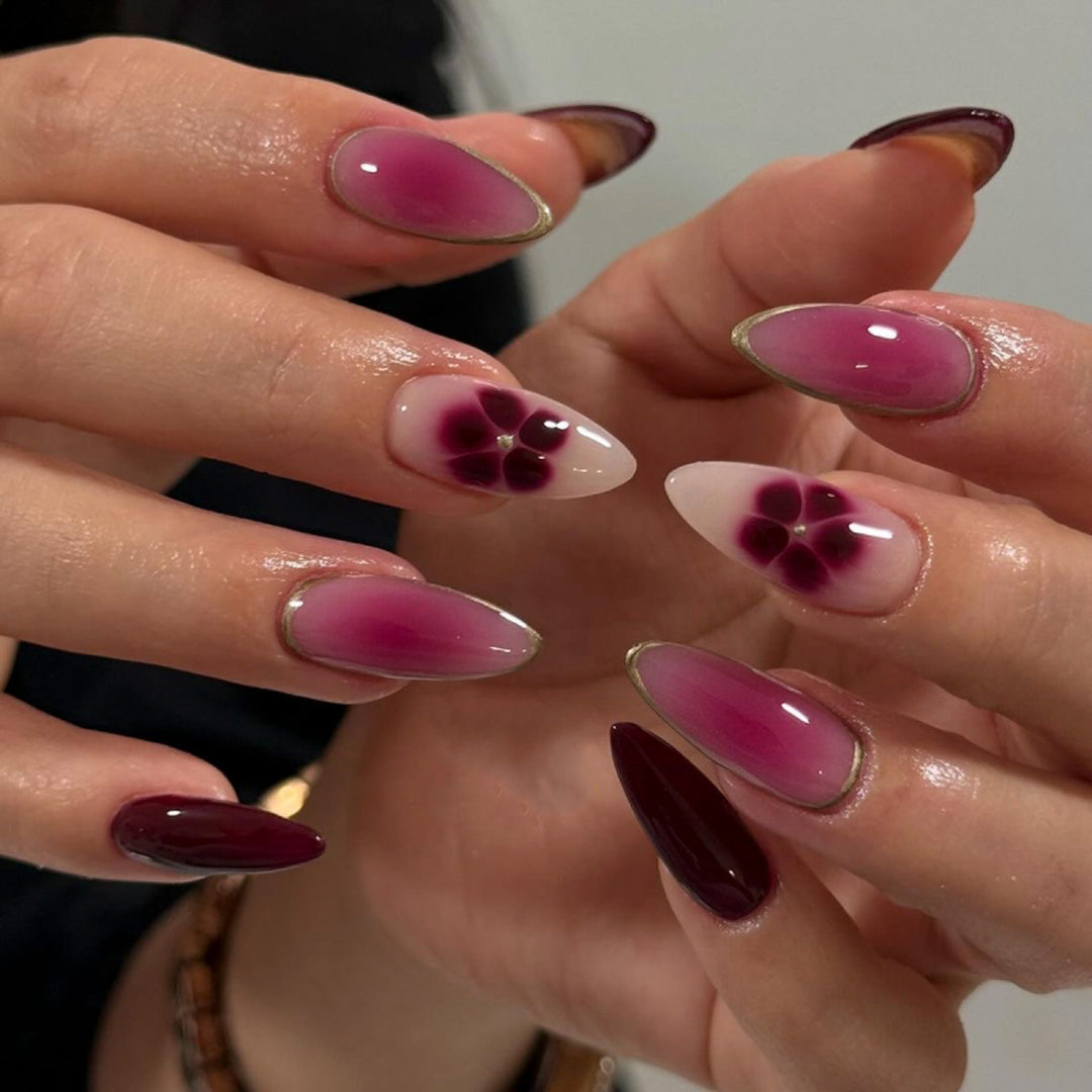 Artistic Nail Art with Ombre Design and Floral Accents Kalsten