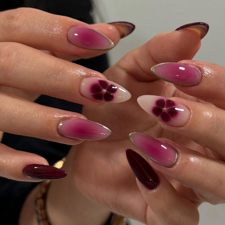 Artistic Nail Art with Ombre Design and Floral Accents Kalsten
