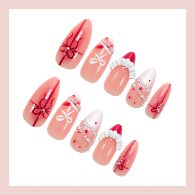 Nail set with glamorous bows and elegant pearl embellishments Kalsten