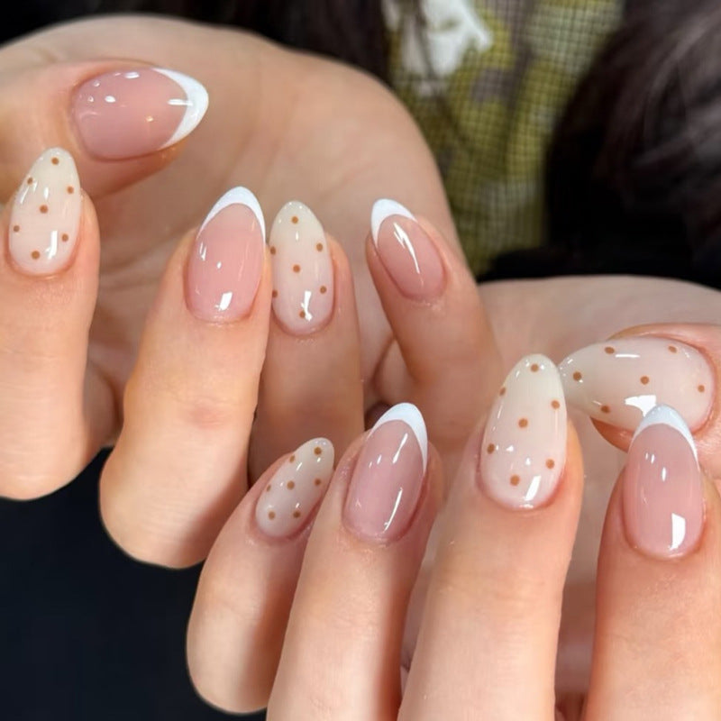 Artificial nail art with playful dots and bows Kalsten