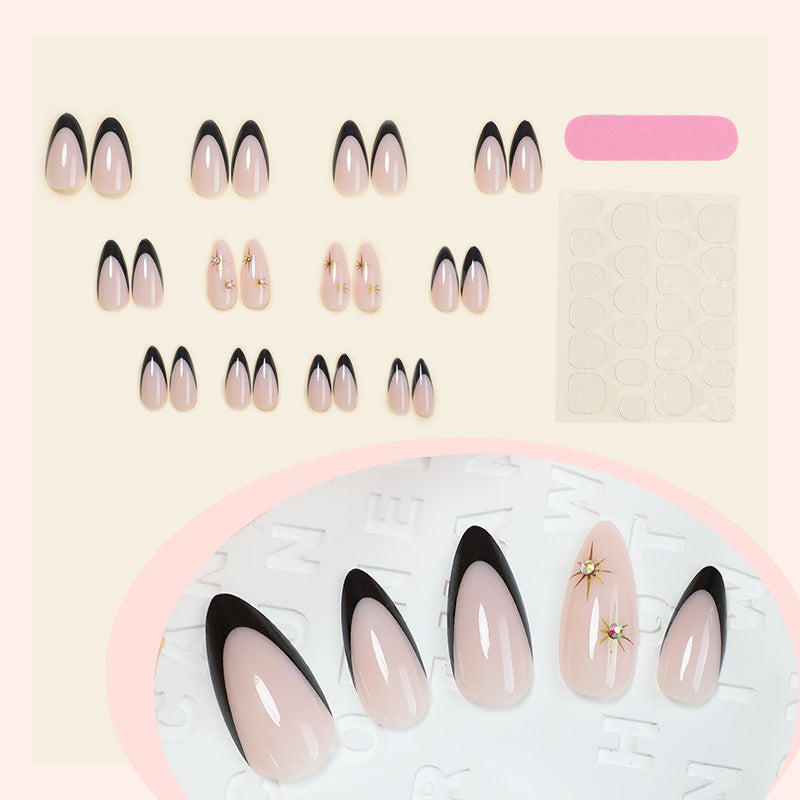 Acrylic nail set with elegant black accents and glamorous details Kalsten