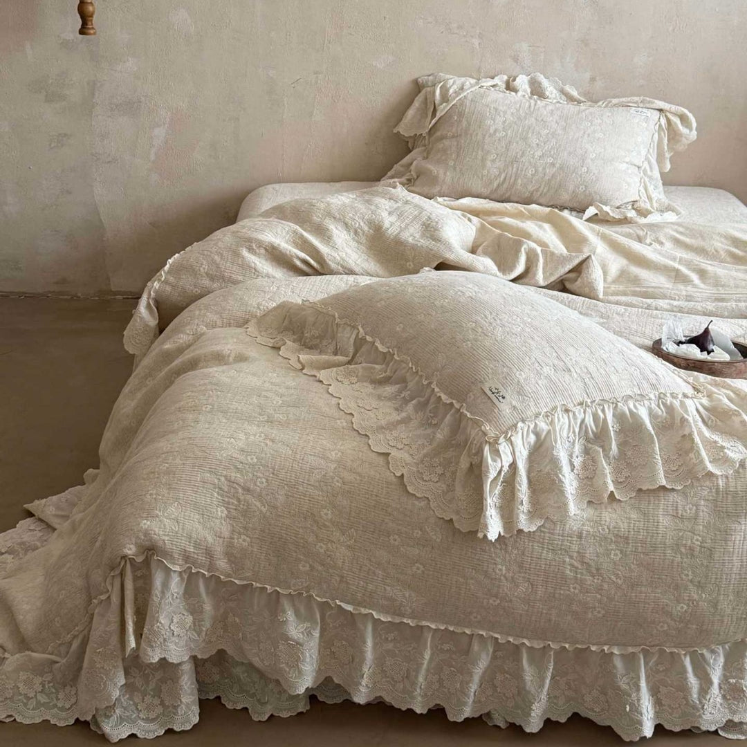 Vintage-inspired ruffled bedding set made of cotton muslin with fine floral embroidery