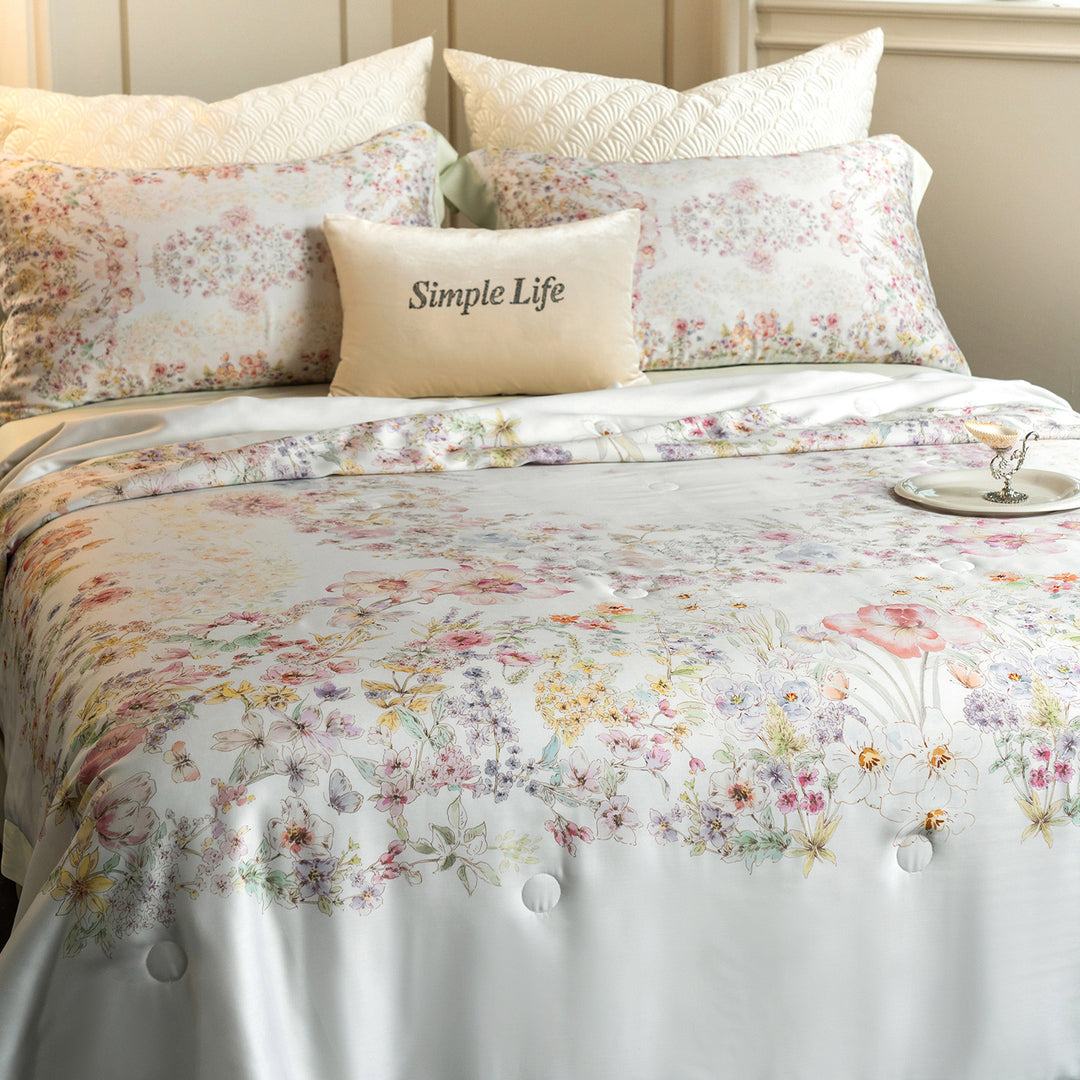 Luxurious cotton satin bed linen set with delicate floral print and quilted bedspread