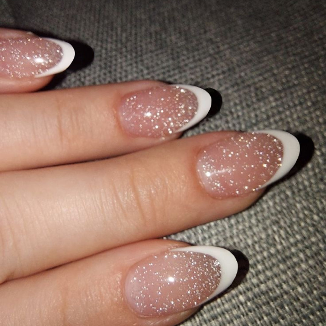 Artful nail art with glitter in gentle tones and elegant tips Kalsten