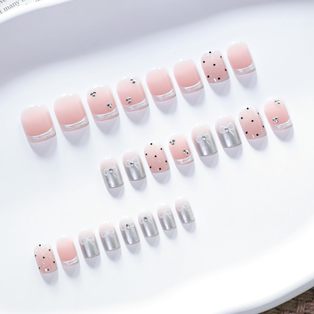 Artistic Nail Art with Bow and Glitter Accents Kalsten
