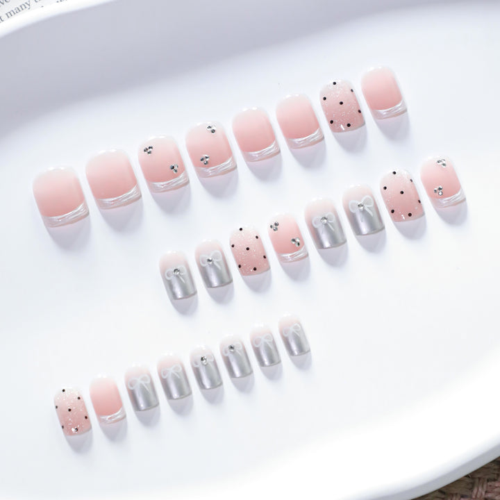 Artistic Nail Art with Bow and Glitter Accents Kalsten